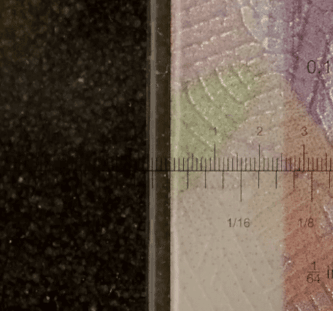 A trading card with centering measurements overlaid